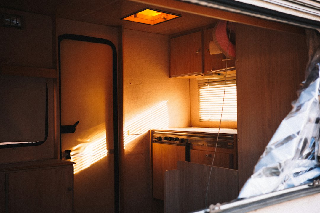 Sunlight through the doorway of a campervan