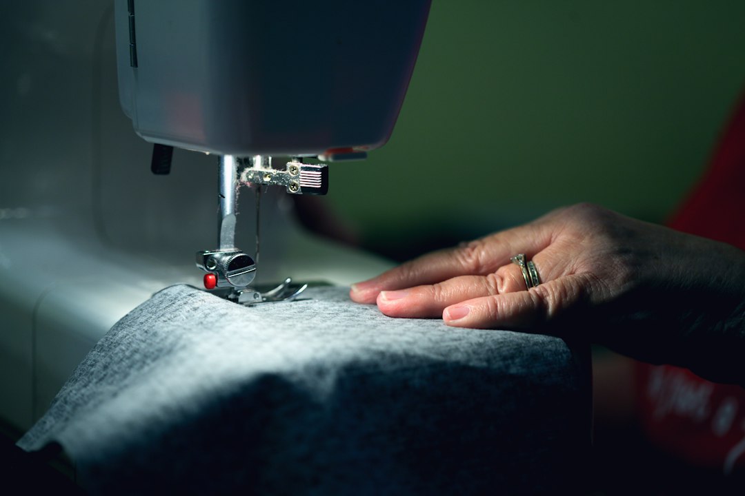 A sewing machine with fabric being made into a curtain
